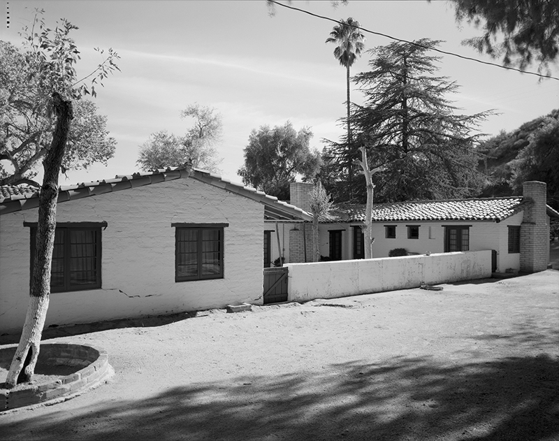 VIEW OF WEST SIDE OF RANCH HOUSE, SHOWING COURTYARD AND BEDROOM WINGS; CAMERA FACING SOUTHEAST