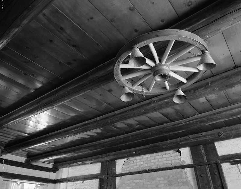 DETAIL OF INTERIOR WOOD CEILING BEAMS LOCATED IN CENTRAL ROOM