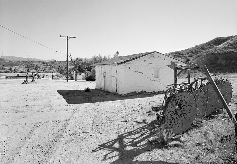 CONTEXTUAL VIEW OF BUILDING 1; SHOWING JOE'S CABIN STABLE (BUILDING 4); CAMERA FACING EAST
