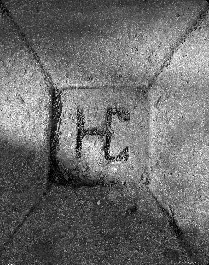 DETAIL OF HAREY CAREY BRAND EMBEDDED IN CONCRETE DRIVE